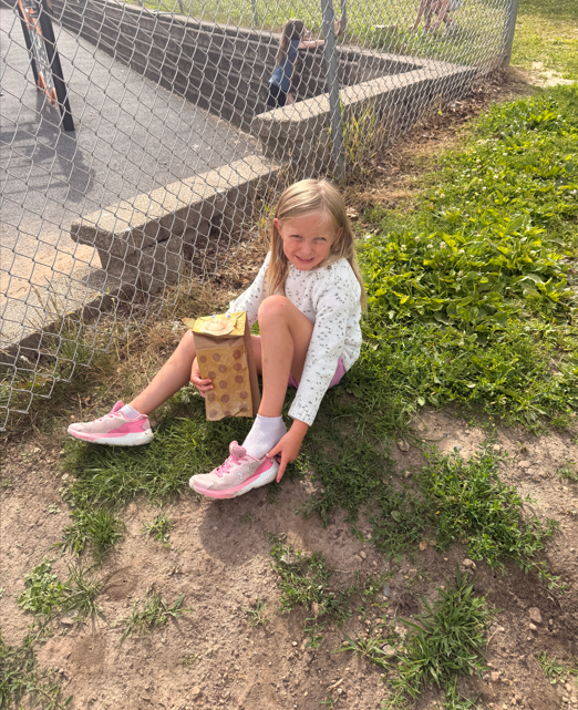 Students outside with animal puppets