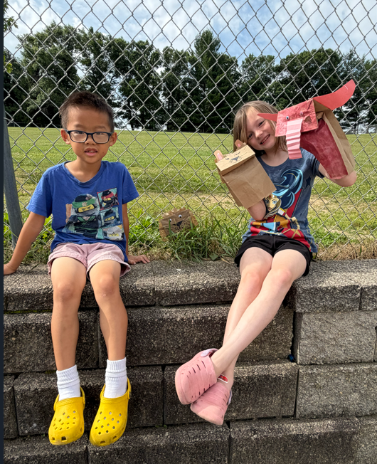 Students outside with animal puppets