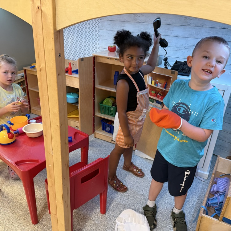 students playing in classroom loft