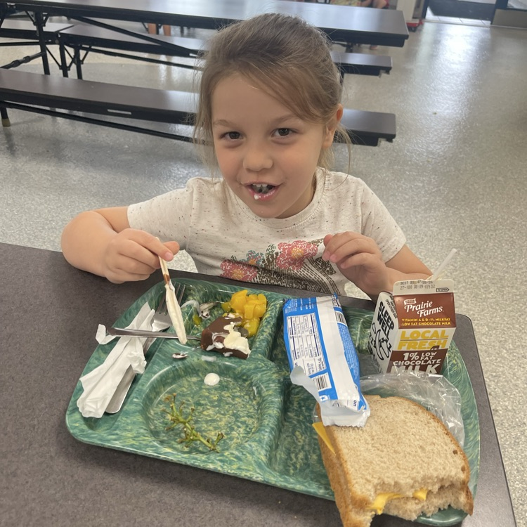 student at lunch table 