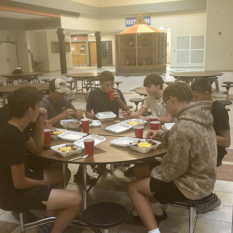 football players eating 