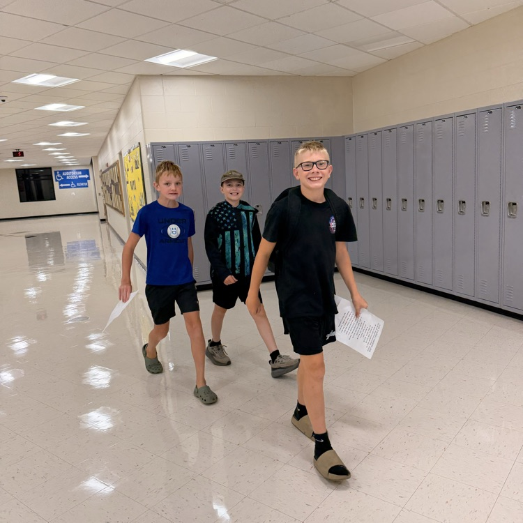 3 boys in hallway 