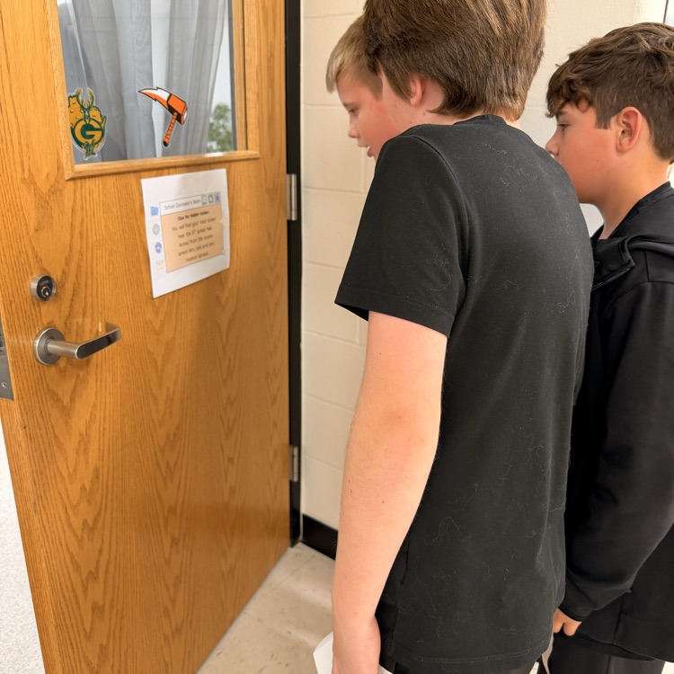 students reading sign 