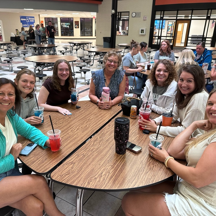 school staff sitting at table