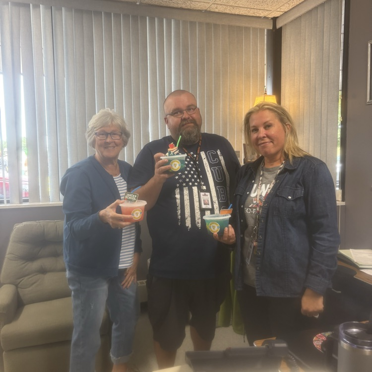 three people holding lemonade 