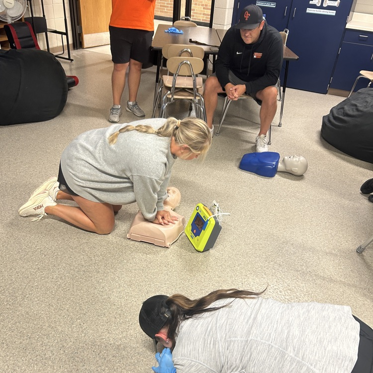 teachers doing cpr training 