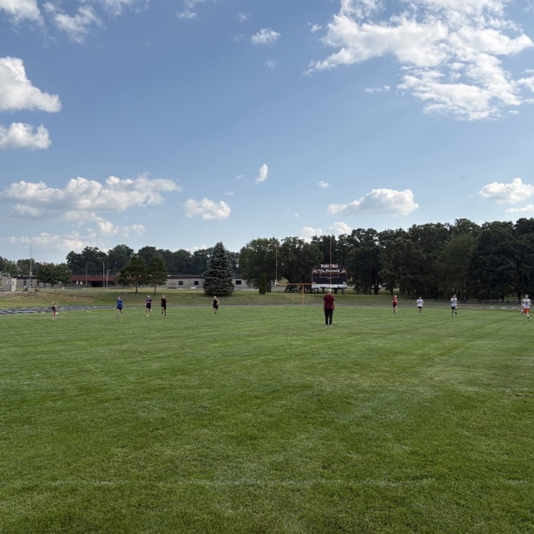 runners on football field 