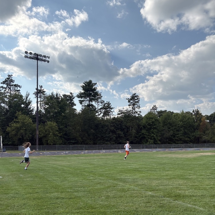 runners practicing on field 