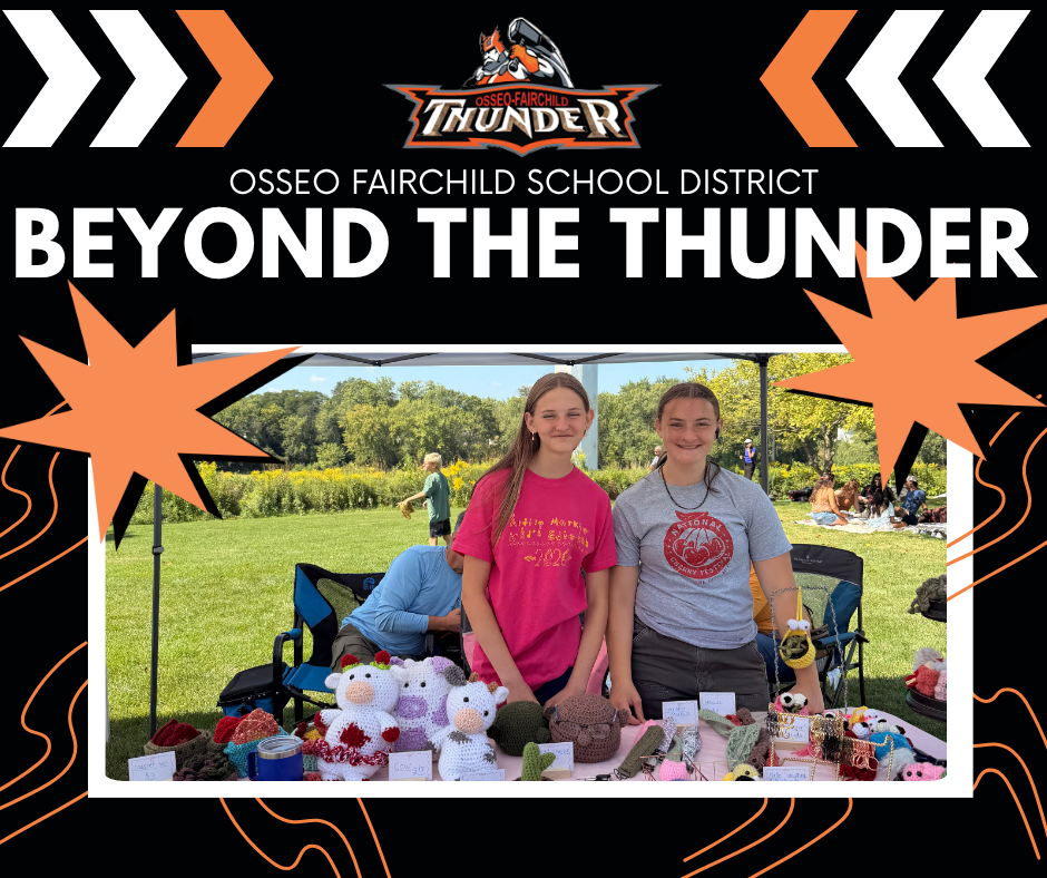 OFSD Beyond The Thunder Two girls standing at outside table displaying craft items