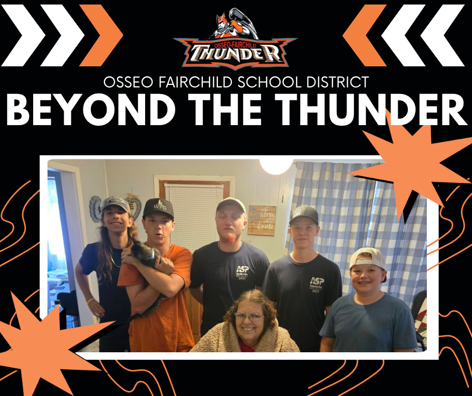Five boys standing behind seated woman. OFSD Beyod The Thunder