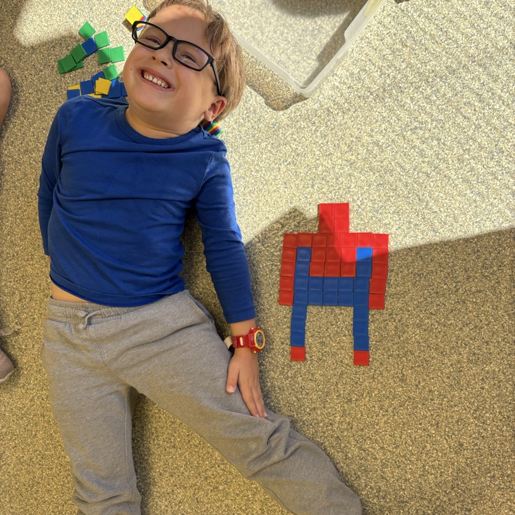 student with pattern blocks