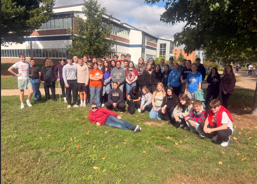 students outside posing in large group