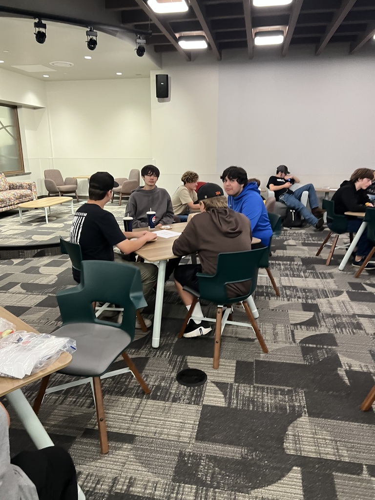 Four students at table eating lunch
