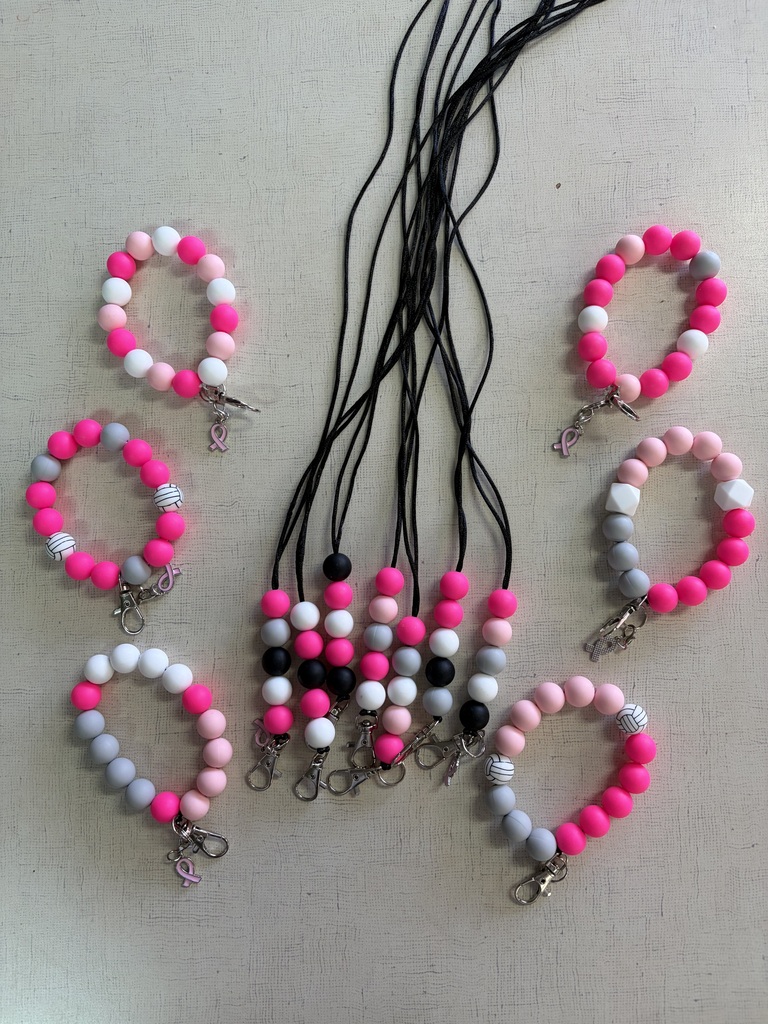 Pink and white lanyards and keychains