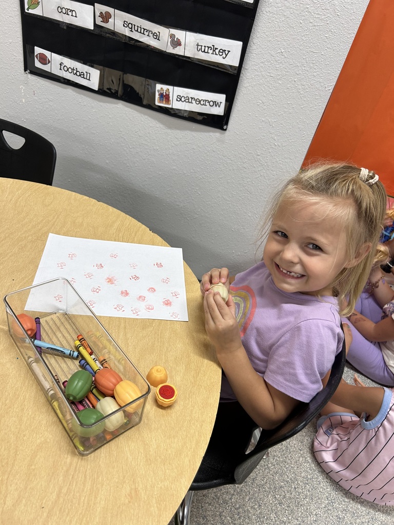 Image Description for accessibility: Student coloring