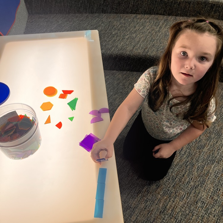 Image description for accessibility: student at lighted table