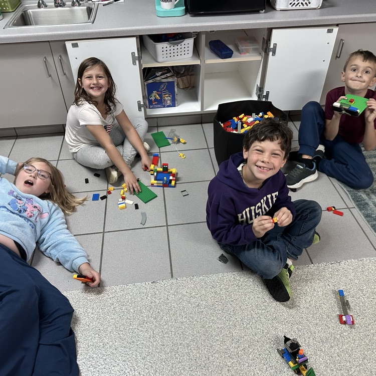 Image description for accessibility: students playing with legos 