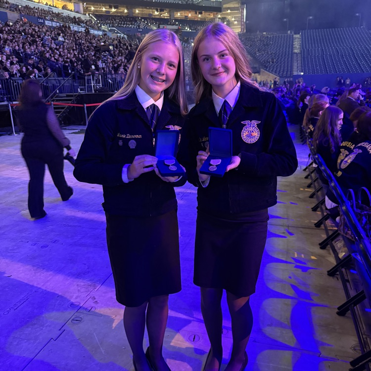 image description for accessibility: students holding awards