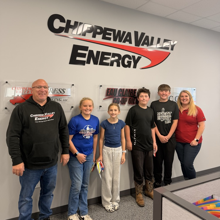 Image description for accessibility students in front of Chippewa Valley energy sign