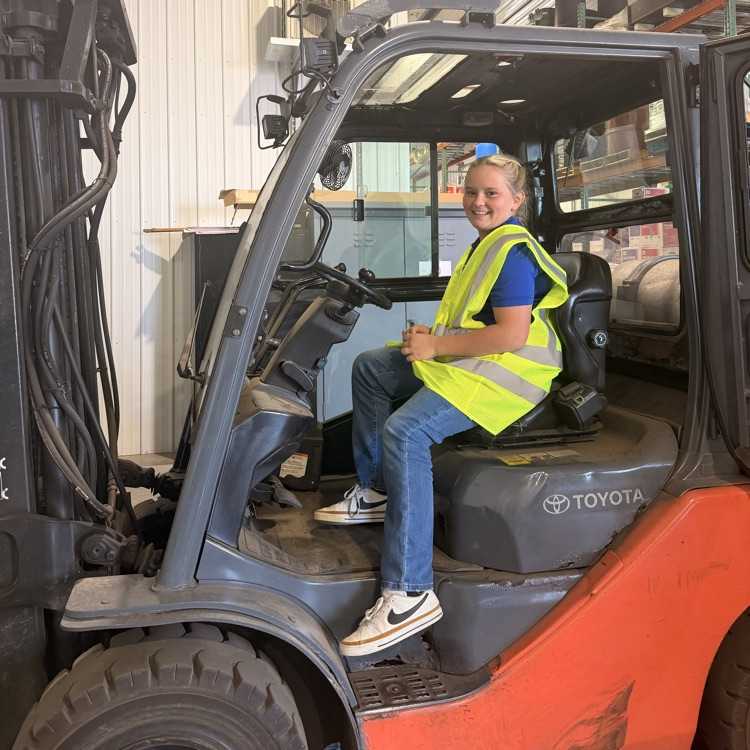 Image description for accessibility student sitting in forklift