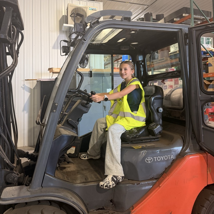 Image description for ex accessibility student sitting in forklift