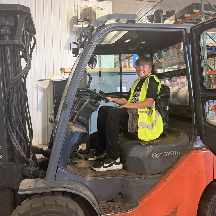 Image description for ex accessibility student sitting in forklift
