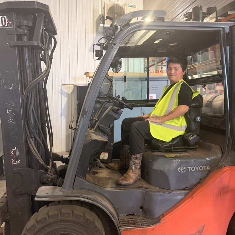 Image description for accessibility student sitting in forklift