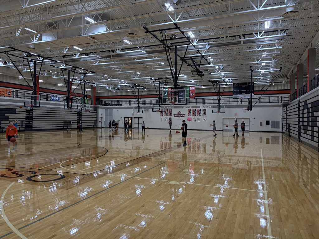 image description for accessibility:  Middle School students in gym (basketball)