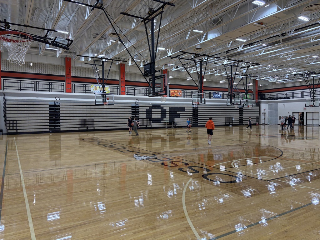 image description for accessibility:  Middle School students in gym (basketball)
