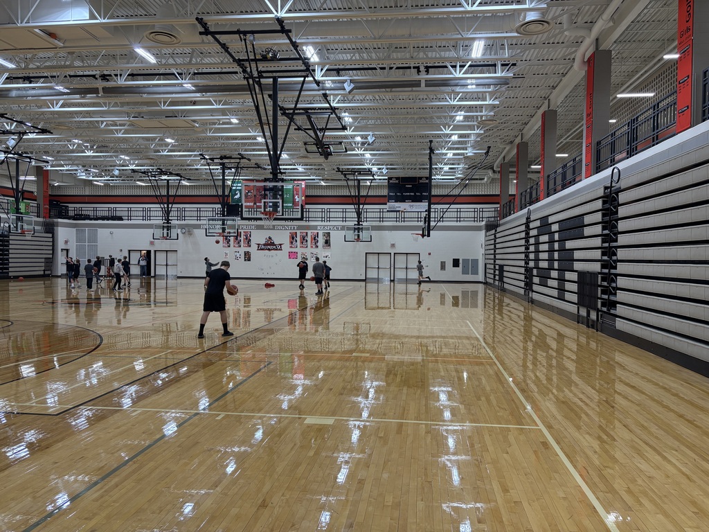image description for accessibility:  Middle School students in gym (basketball)