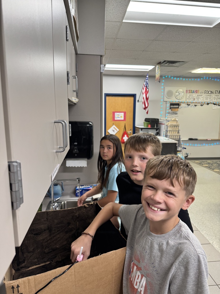 Image Description for accessibility:  Students working on Space Unit projects