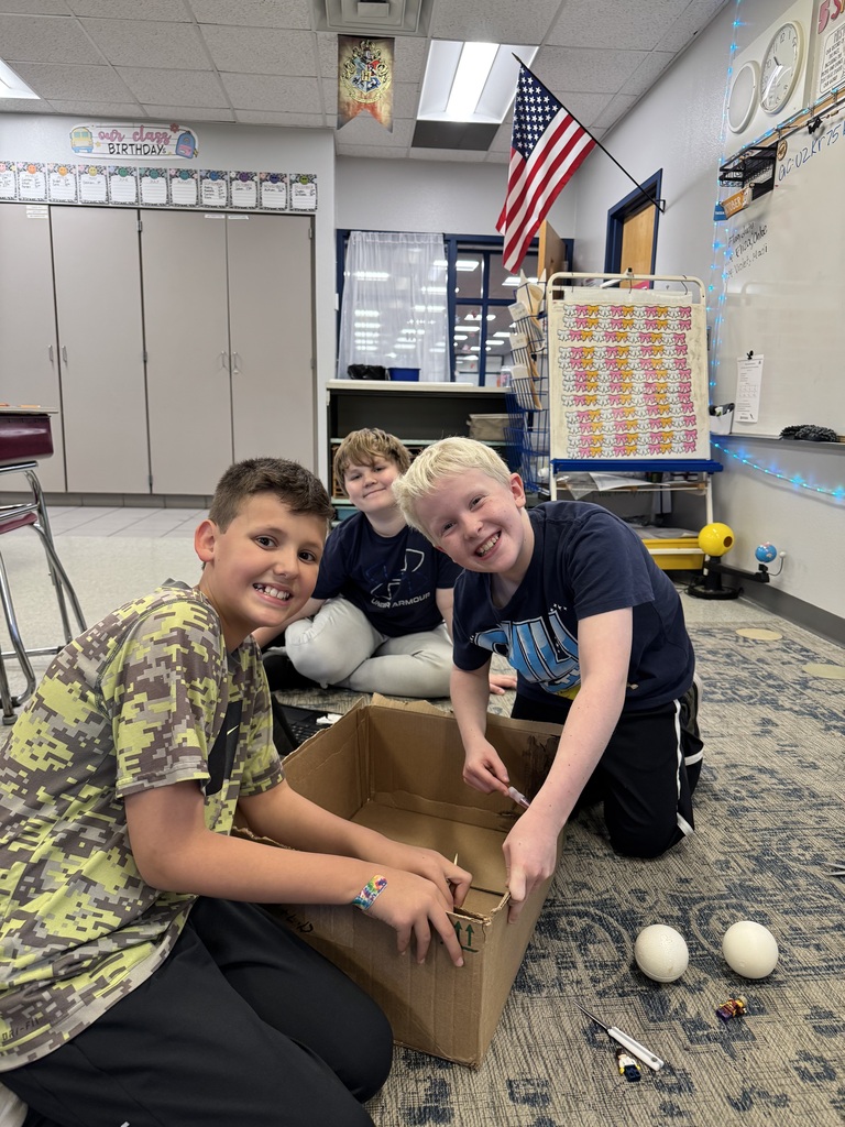 Image Description for accessibility:  Students working on Space Unit projects