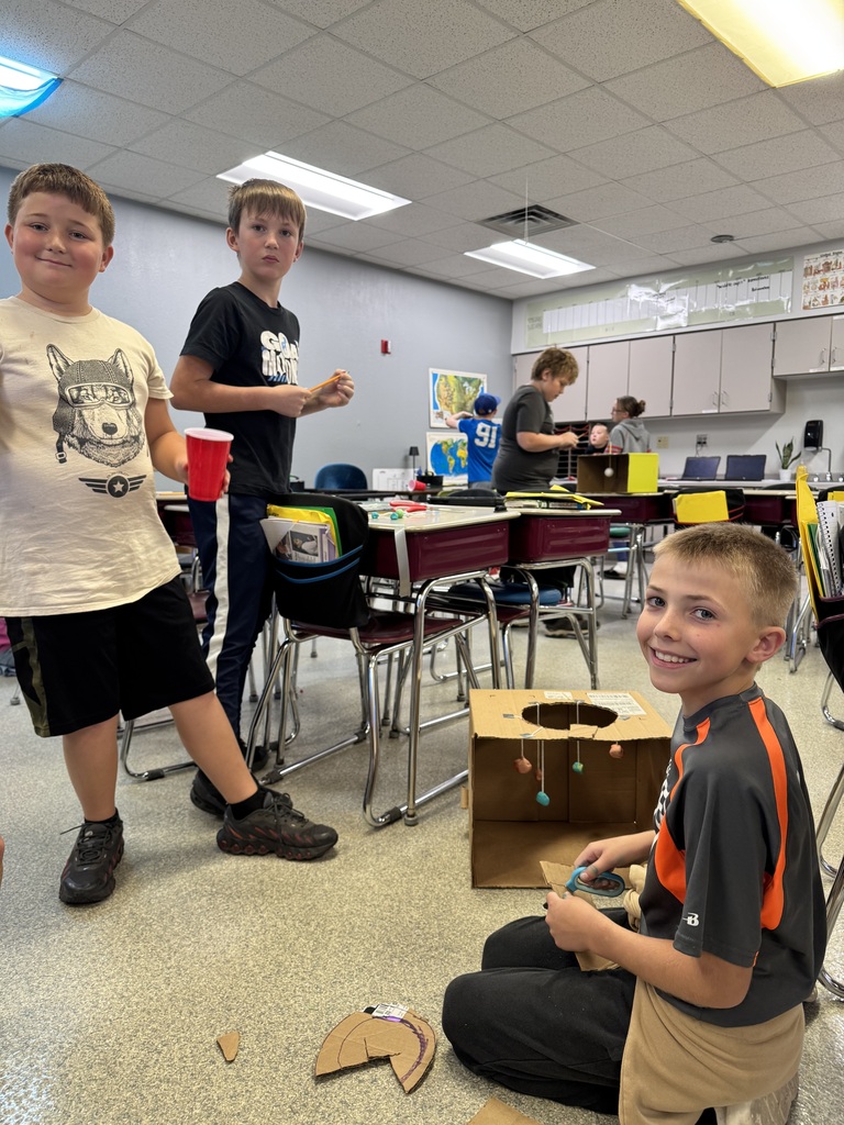 Image Description for accessibility:  Students working on Space Unit projects