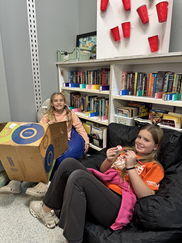 Image Description for accessibility:  Students working on Space Unit projects
