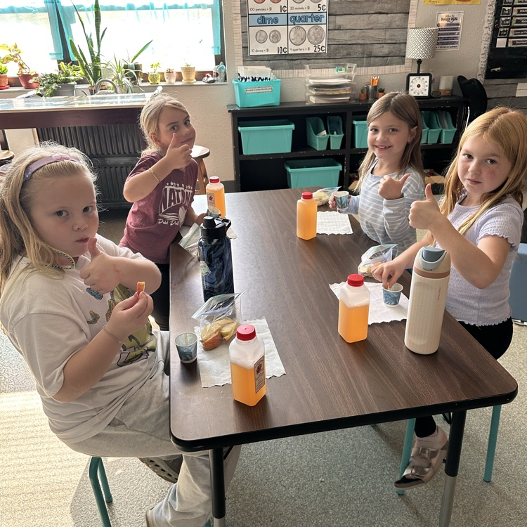 Image Description For Accessibility: students enjoying apples and cider