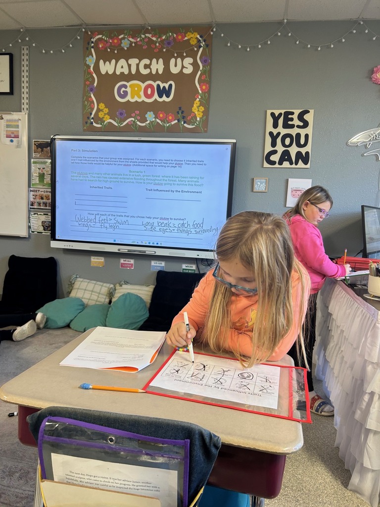Image description for accessibility:  student working with a marker and paper