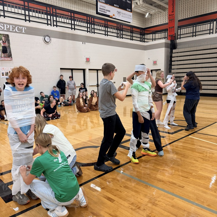 Image description for accessibility students wrapping other students toilet paper
