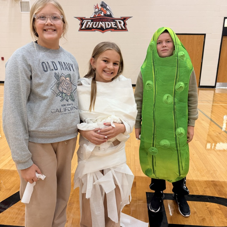 image description for accessibility three students in Halloween costumes