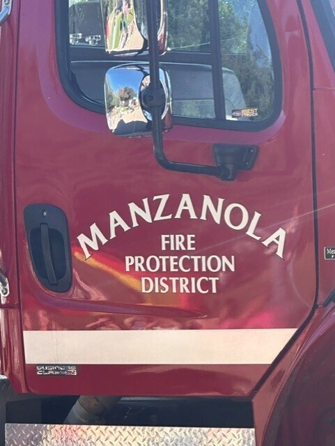 Picture of the Manzanola Fire Protection District logo on the fire truck door