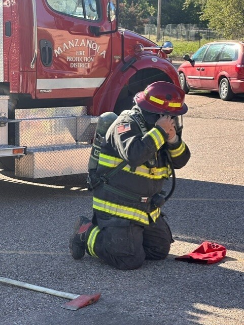 Firefighter putting on his gear
