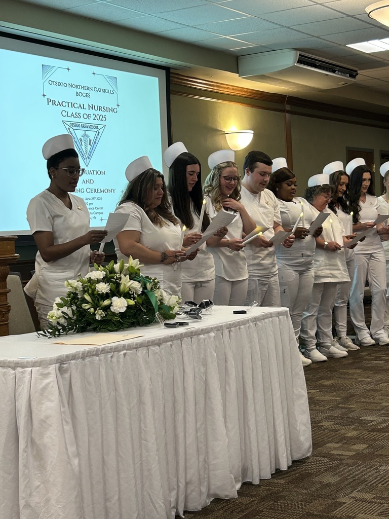 Students on stage with their candles