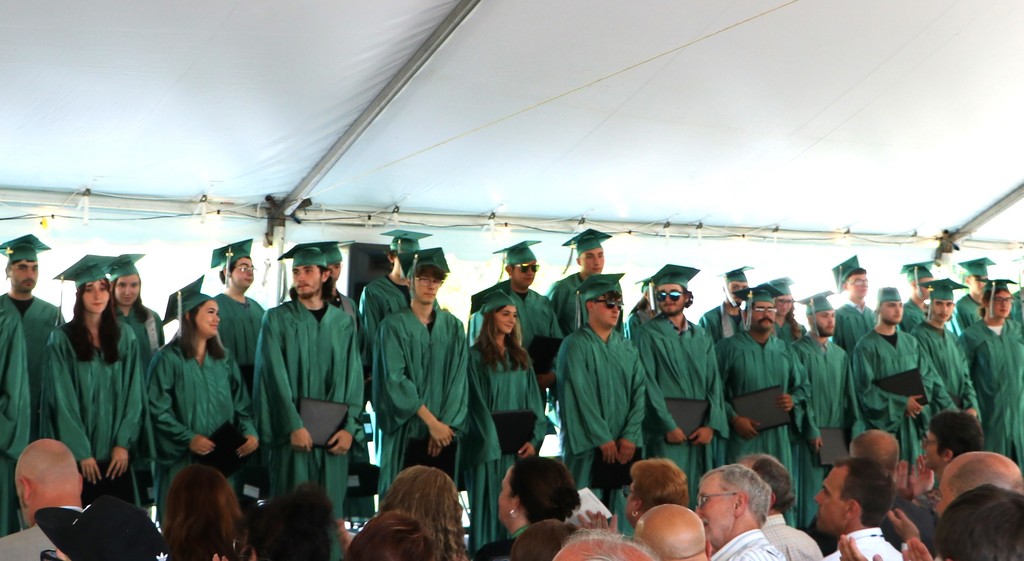 Group of students inside the tent after receiving their certificates