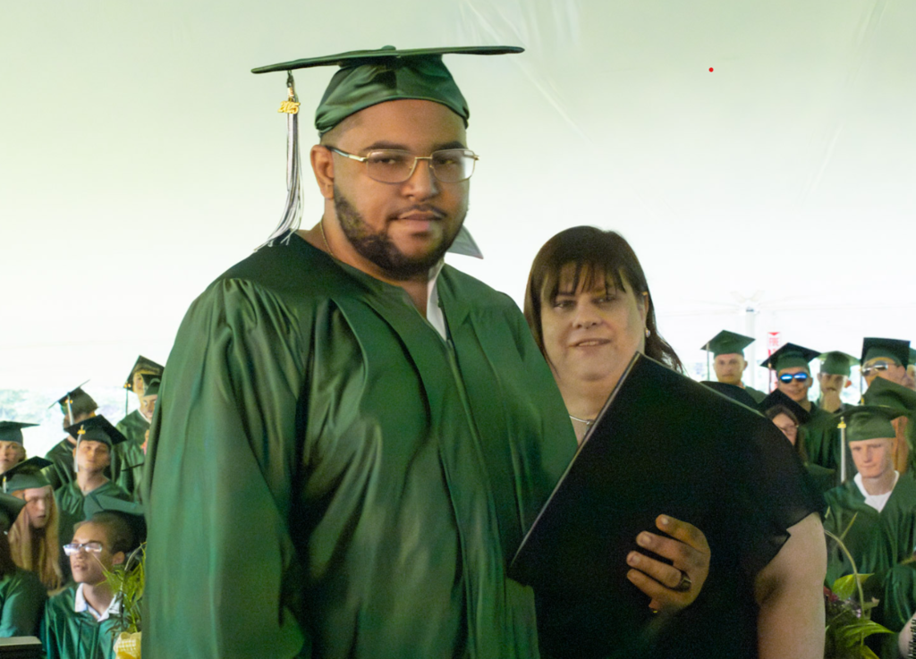 Student receiving certificate with instructor