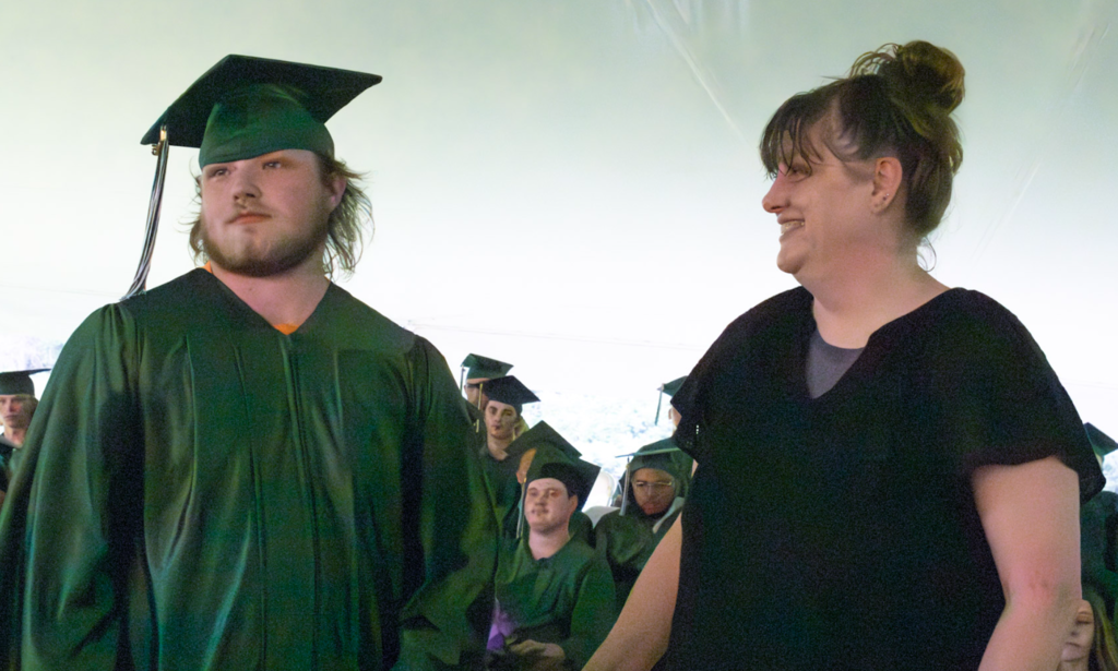 Student receiving certificate with instructor