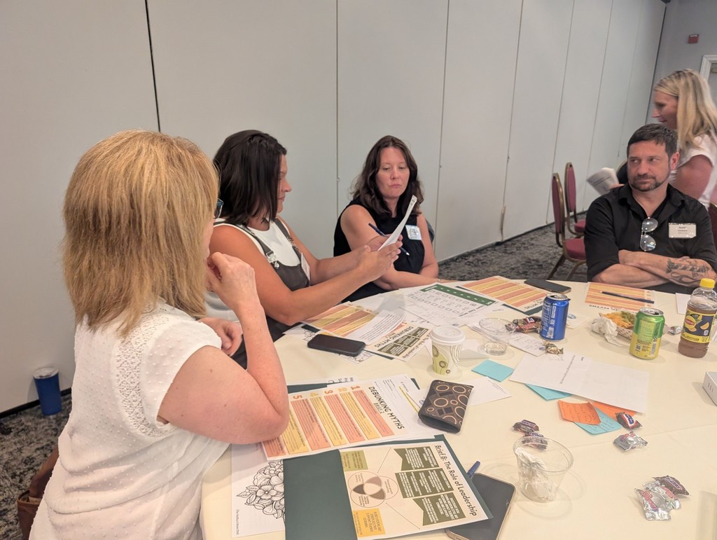 A group of people working together at a table