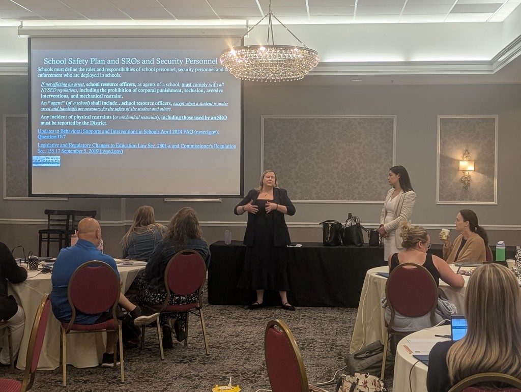 Two presenters discussing school safety plans and SROs