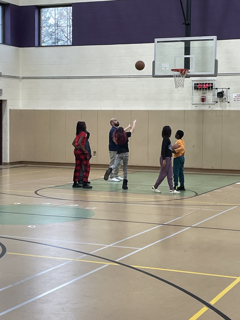 Teacher and 5 students playing basketball