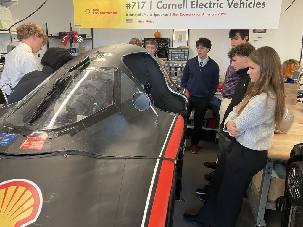 Students looking at an  Electric Vehicle