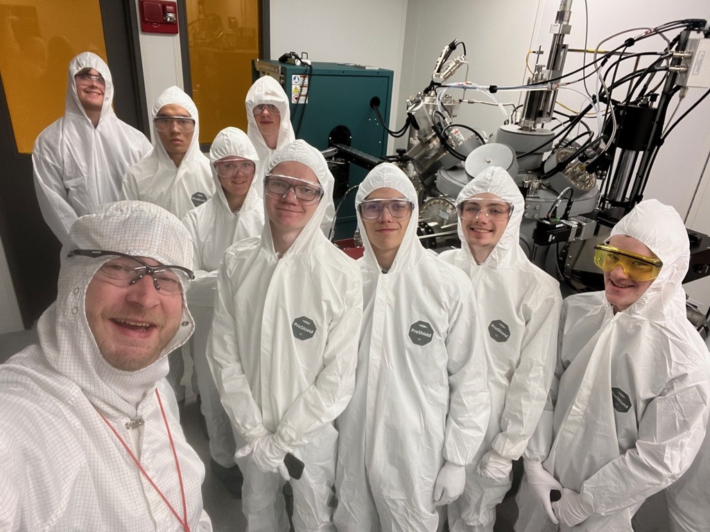 Students in full "bunny suits" in the clean room
