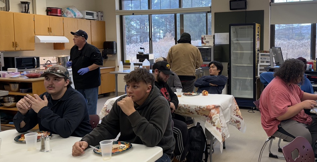 Students gathered in a room for the College and Careers for Every Student/Brilliant Pathways kickoff event sharing a meal with mentors and mentees